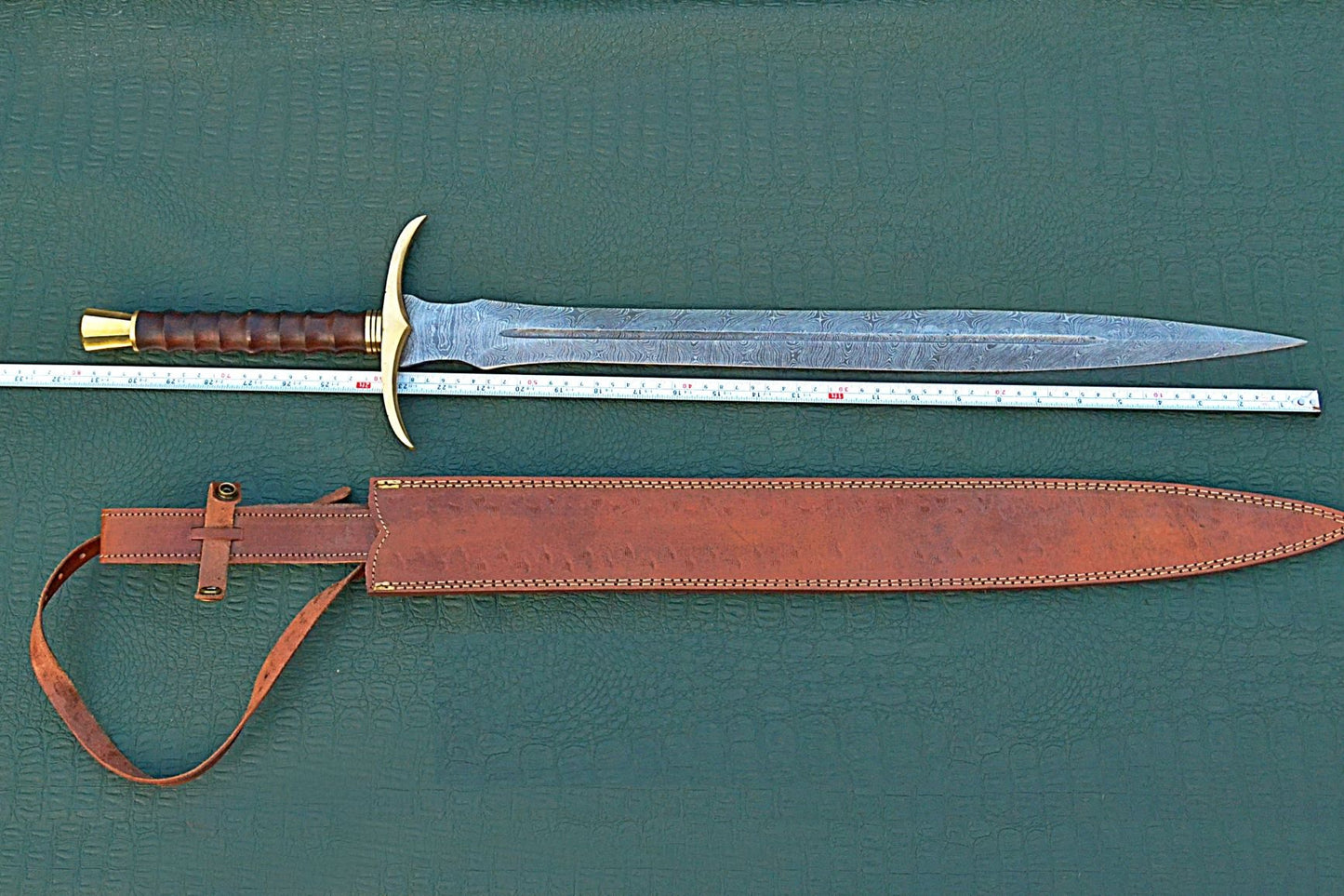 32 inches Long Sting Sword, 22" Long Hand Forged Damascus Steel Double Edge Blade, Brass Cross hilt Forward and Pommel, Walnut Wood Serrated Grip, Leather Scabbard with Shoulder Stripe