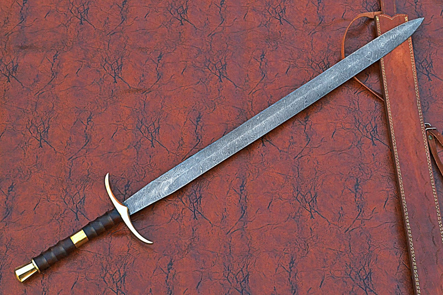 38 inches Long Claymore Sword, 30" Long Hand Forged Damascus Steel Double Edge Blade, Forward Brass Cross hilt Forward and Pommel, Leather Scabbard with Shoulder Stripe