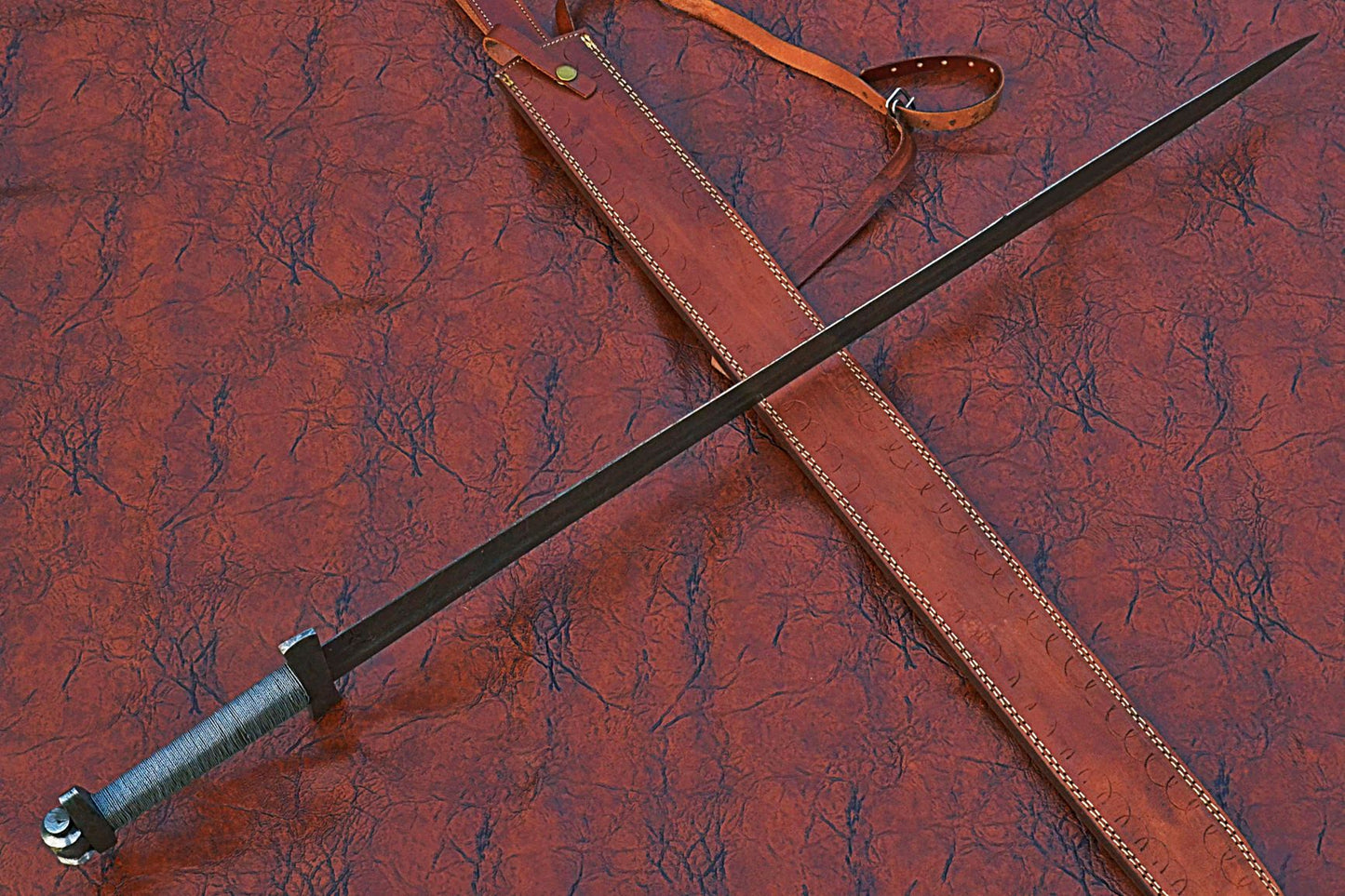 38 inches long Gladius sword, 31" long Hand forged Damascus steel double edge blade, Solid Damascus steel cross guard and pommel, Matching color thread wrap grip, Leather scabbard with shoulder stripe