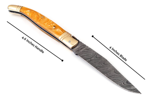 Copy of Laguiole Folding Damascus steel knife, 8.5" Long with 4" hand forged custom twist pattern Blade. Beige color unshrinkable Raisen scale with brass bolster, Cow hide leather sheath included