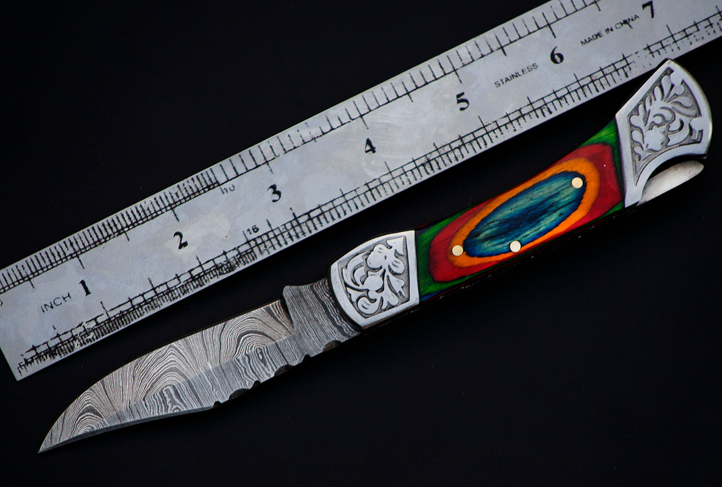 Copy of 7" long back lock Folding Knife, Blue & Orange colored wood Scale with Engraved steel bolster, custom made 3.25" Hand Forged Damascus steel blade, Cow hide leather sheath with belt loop