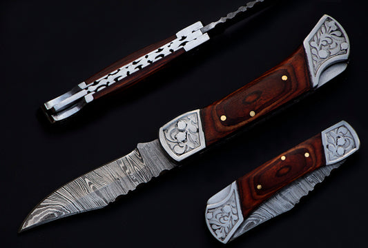 7" long back lock Folding Knife, Rose wood Scale with Engraved steel bolster, custom made 3.25" Hand Forged Damascus steel blade, Cow hide leather sheath with belt loop