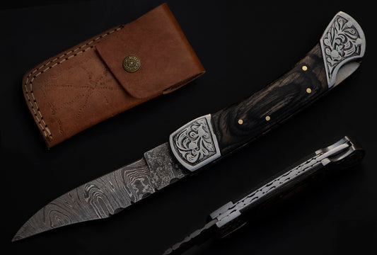 9" long back lock Folding Knife, Black wood Scale with Engraved steel bolster, custom made 4" Hand Forged Damascus steel blade, Cow hide leather sheath with belt loop