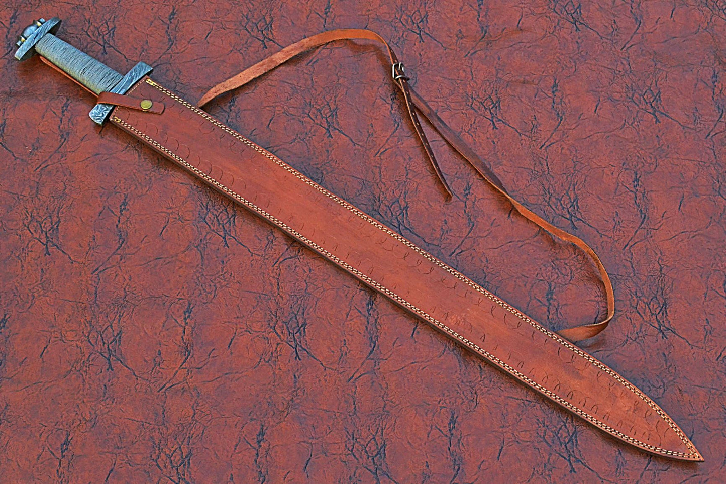 38 inches long Gladius sword, 31" long Hand forged Damascus steel double edge blade, Solid Damascus steel cross guard and pommel, Matching color thread wrap grip, Leather scabbard with shoulder stripe
