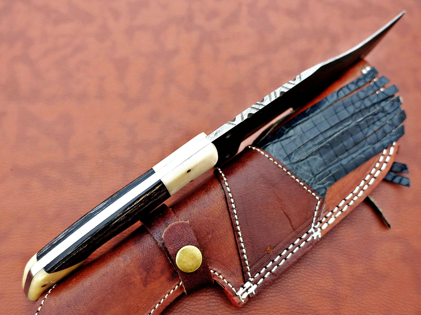 12" Long hand forged twist pattern full tang Damascus steel tracker knife, 2 tone dollar wood scale with Camel bone Bolster & pomel, Cow leather sheath