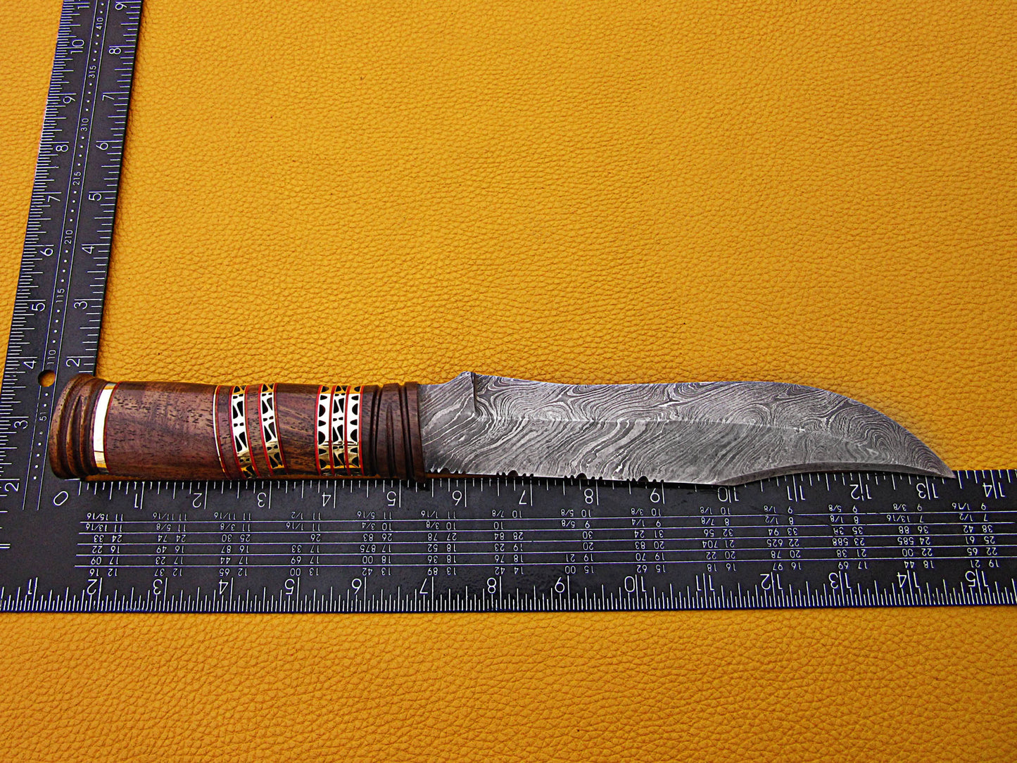 13.5" Long hand forged Damascus steel exotic Hunting Knife with 7" blade, Exotic Rose wood scale crafted with engraved brass & fiber spacing, Cow Leather sheath included