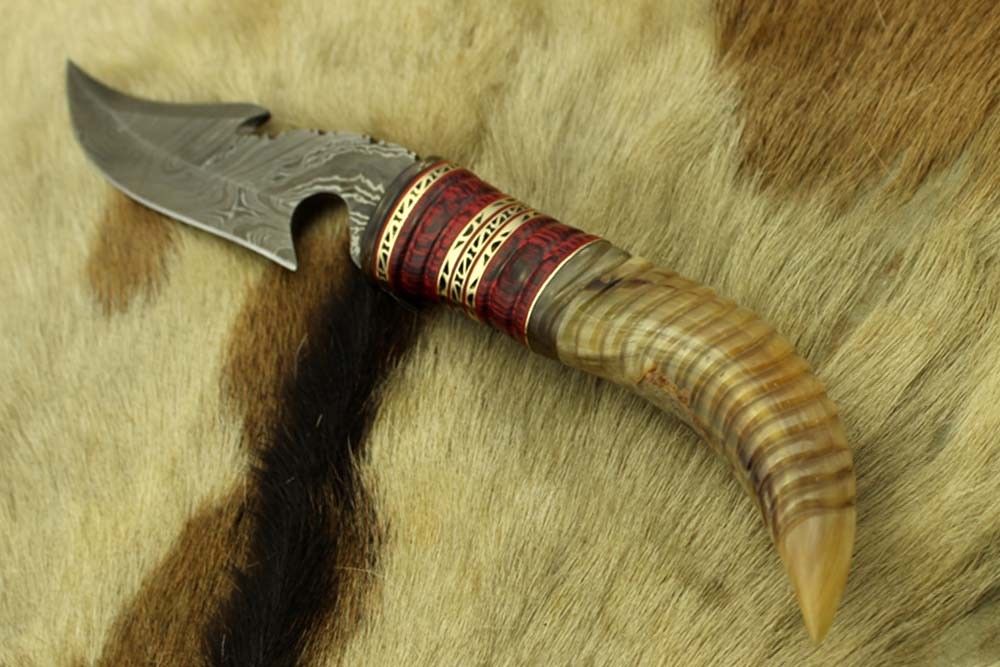 13" Long hand forged Damascus steel gut hook Skinning Knife, Custom made Round engraved jigged scale Crafted with engraved Brass spacer, Cow hide Leather sheath