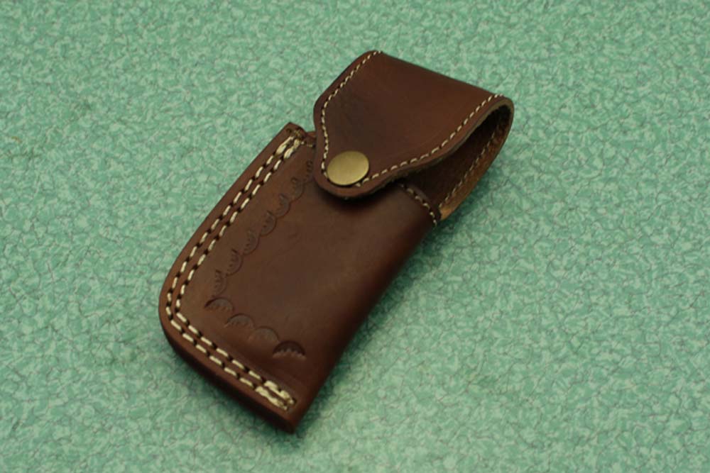 8 Inch Damascus steel folding knife, Available in Bone, Bull horn and Ram scales with Damascus bolster, Equipped with Thumb closing knob and liner lock, Cow hide Leather sheath with belt loop
