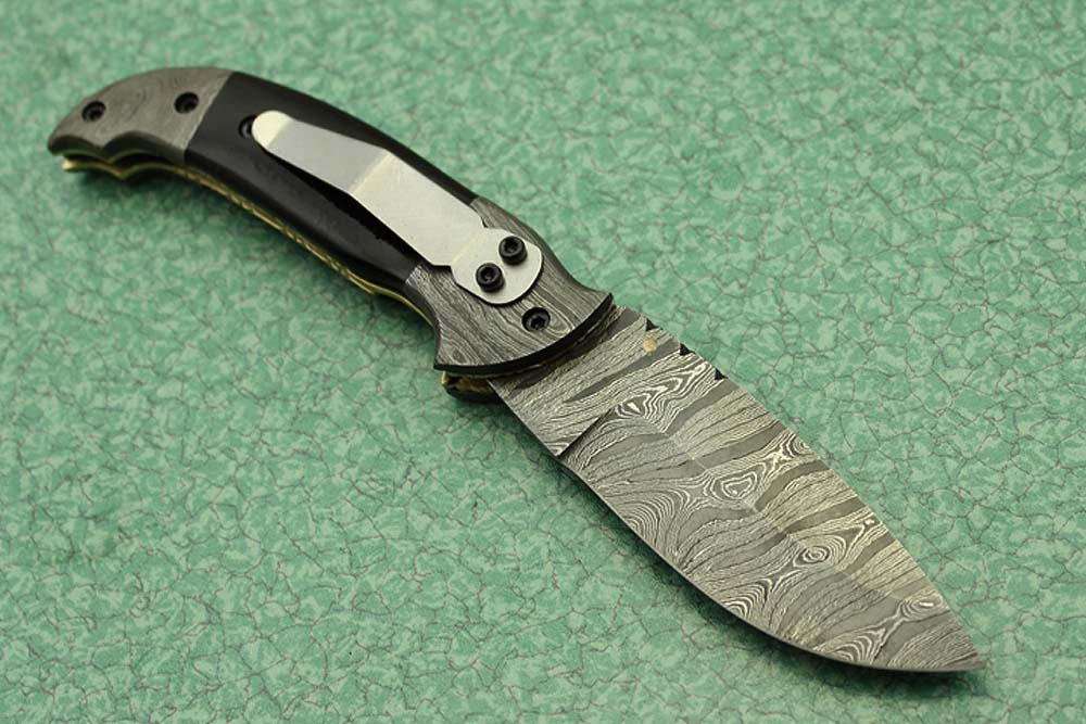 8 Inch Damascus steel folding knife, Available in Bone, Bull horn and Ram scales with Damascus bolster, Equipped with Thumb closing knob and liner lock, Cow hide Leather sheath with belt loop