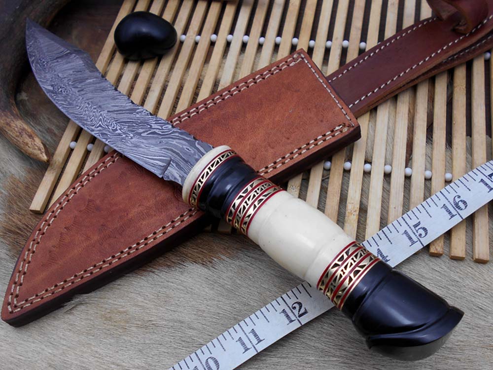 13.5 Inches long Hand Forged Damascus hunting Bowie Knife 8" blade. Camel bone, engraved brass & horn exotic scale cow hide leather sheath