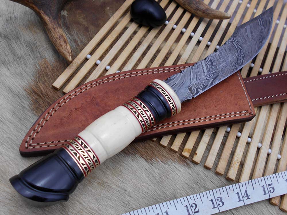13.5 Inches long Hand Forged Damascus hunting Bowie Knife 8" blade. Camel bone, engraved brass & horn exotic scale cow hide leather sheath