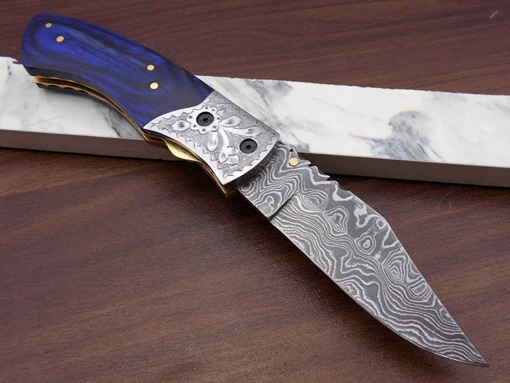 8" long hand forged custom made Damascus steel pocket clip folding knife, Blue Colored wood scale with engraved steel Bolster, Cow hide leather sheath included