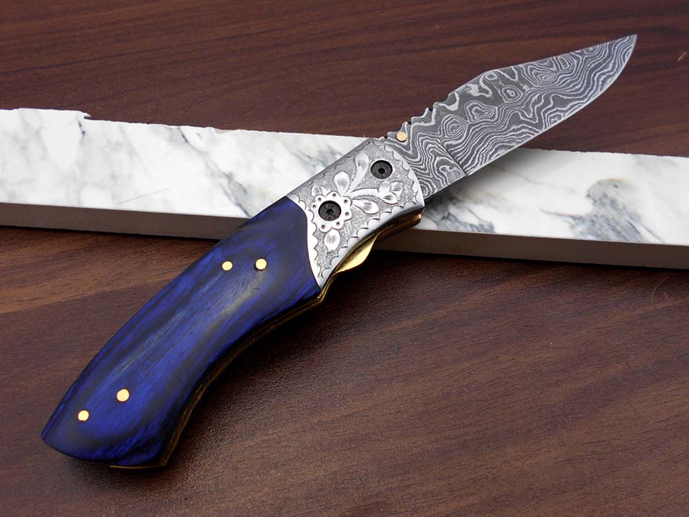 8" long hand forged custom made Damascus steel pocket clip folding knife, Blue Colored wood scale with engraved steel Bolster, Cow hide leather sheath included