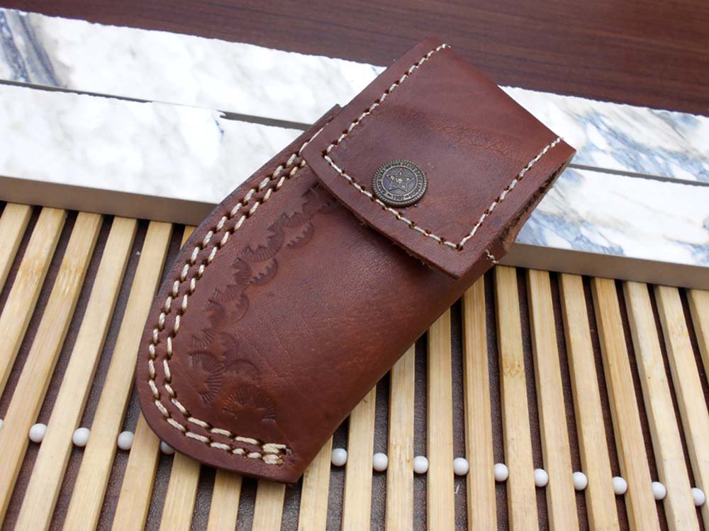 7.5" Damascus folding knife with Damascus bolster on both edges with thumb knob & liner lock equipped, Available in 4 scales, Cow hide leather sheath with belt loop included