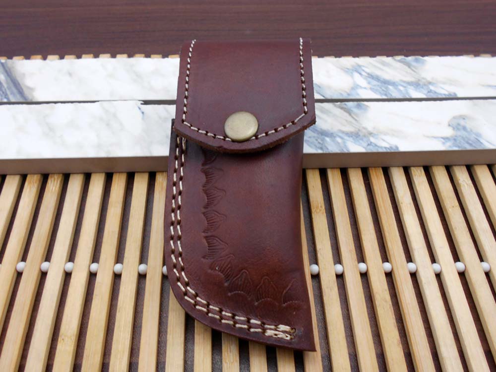 Damascus steel folding knife 7.5" long hand forged custom made 3.5" Tanto blade, Ram horn scale with Damascus bolster, Cow leather sheath