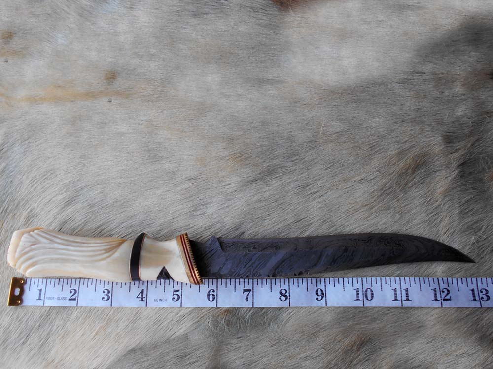 13 " long Damascus steel skinning knife, exotic hand carved Camel bone scale crafted with engraved brass, spacer and sliced bull horn, Cow hide leather sheath included.