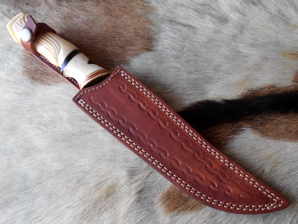 13 " long Damascus steel skinning knife, exotic hand carved Camel bone scale crafted with engraved brass, spacer and sliced bull horn, Cow hide leather sheath included.