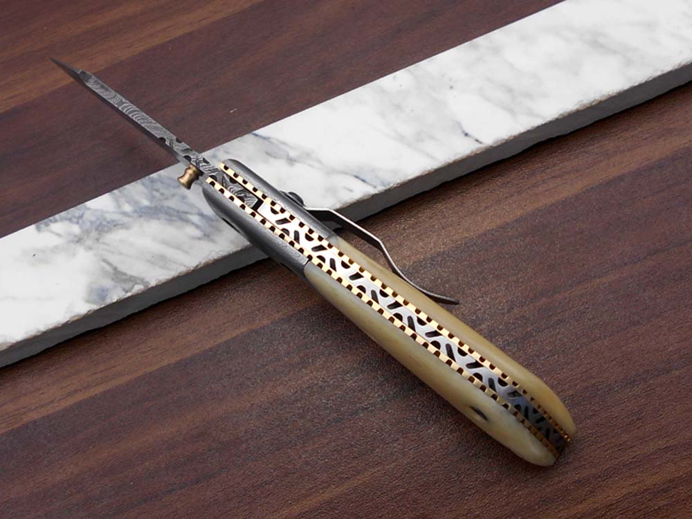 Damascus steel 7.5" long Folding Knife Bull horn with Damascus bolster pocket clip scale, custom made Hand Forged blade cow leather sheath