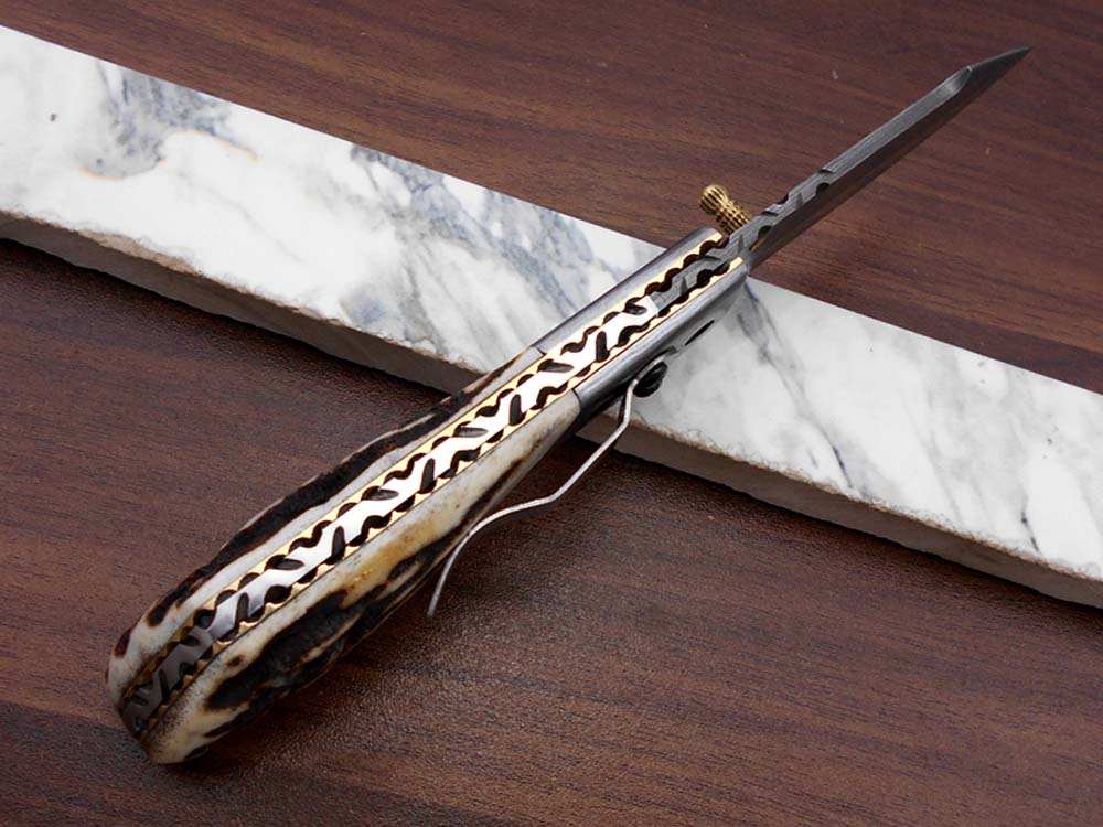 Damascus steel 7.5" long Folding Knife Bull horn with Damascus bolster pocket clip scale, custom made Hand Forged blade cow leather sheath