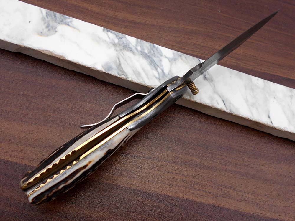 Damascus steel 7.5" long Folding Knife Bull horn with Damascus bolster pocket clip scale, custom made Hand Forged blade cow leather sheath