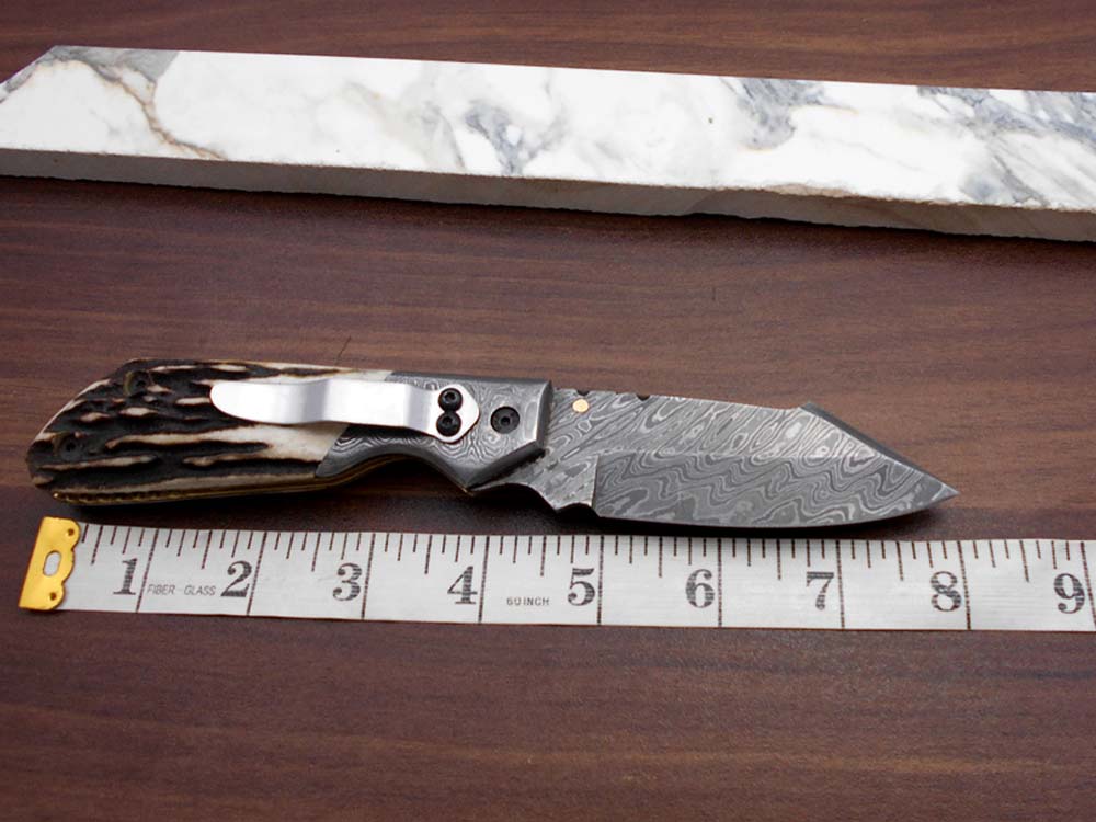 Damascus steel 7.5" long Folding Knife Bull horn with Damascus bolster pocket clip scale, custom made Hand Forged blade cow leather sheath