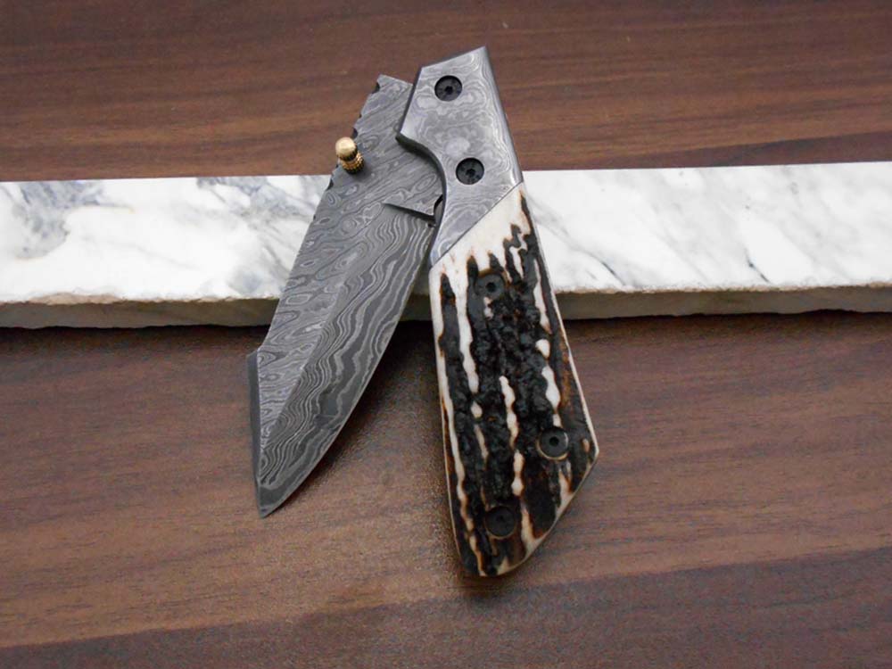 Damascus steel 7.5" long Folding Knife Bull horn with Damascus bolster pocket clip scale, custom made Hand Forged blade cow leather sheath