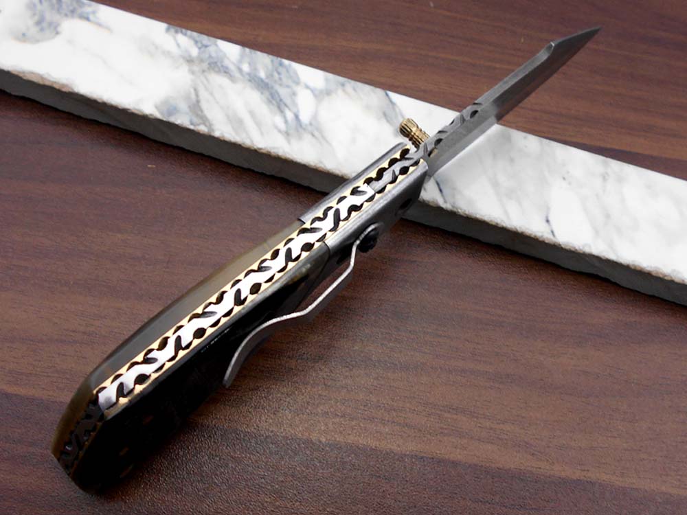 Damascus steel 7.5" long Folding Knife Bull horn with Damascus bolster pocket clip scale, custom made Hand Forged blade cow leather sheath