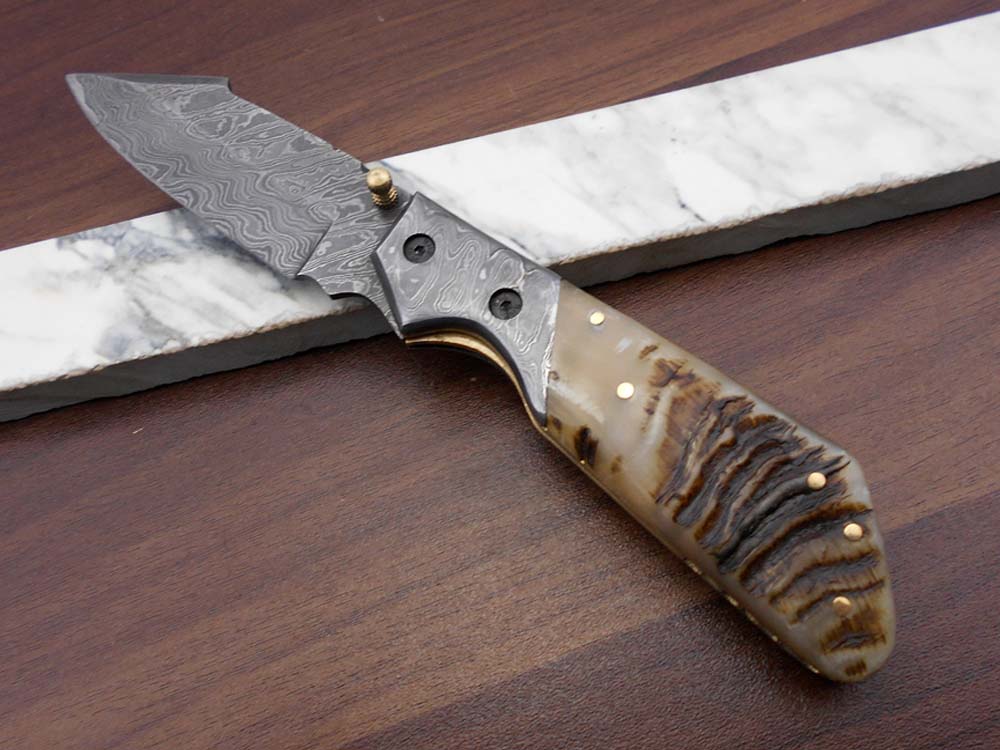 Damascus steel 7.5" long Folding Knife Bull horn with Damascus bolster pocket clip scale, custom made Hand Forged blade cow leather sheath