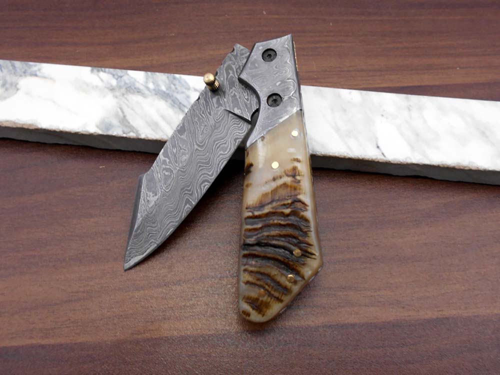 Damascus steel 7.5" long Folding Knife Bull horn with Damascus bolster pocket clip scale, custom made Hand Forged blade cow leather sheath