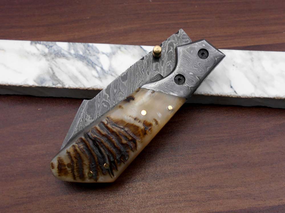 Damascus steel 7.5" long Folding Knife Bull horn with Damascus bolster pocket clip scale, custom made Hand Forged blade cow leather sheath