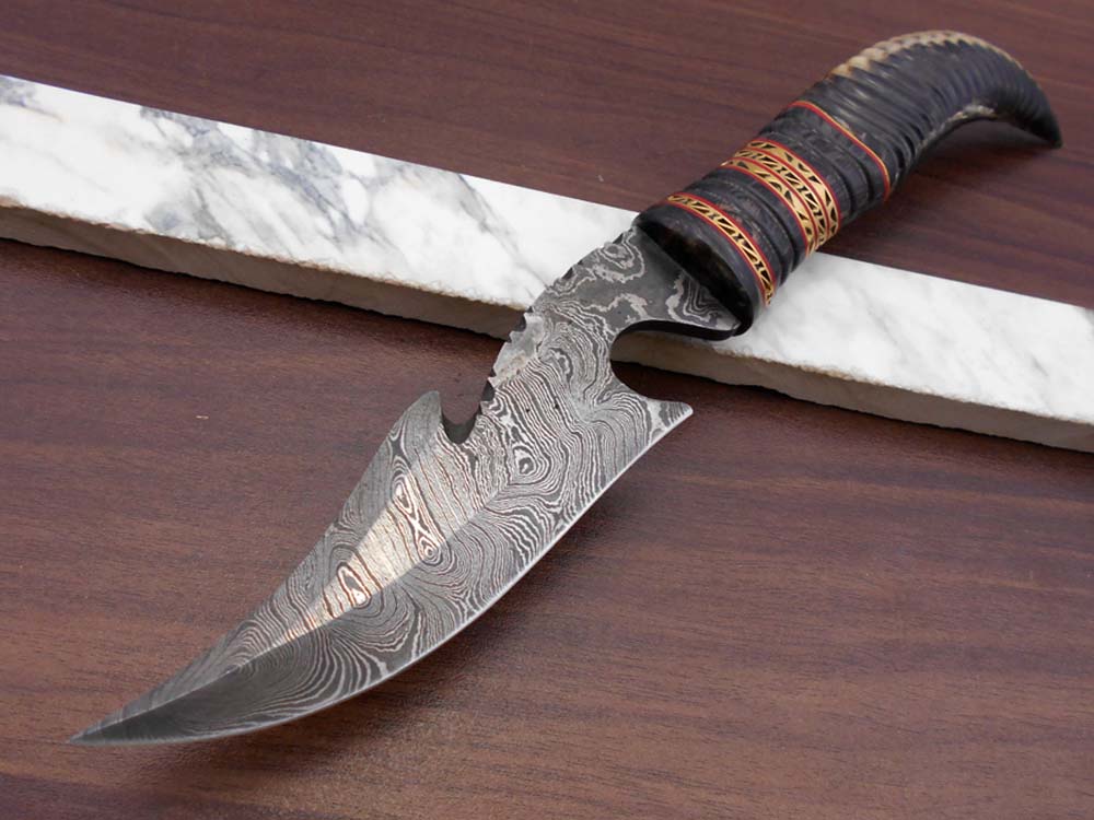 13" Long hand forged Damascus steel gut hook Skinning Knife, Custom made Round engraved jigged scale Crafted with engraved Brass spacer, Cow hide Leather sheath
