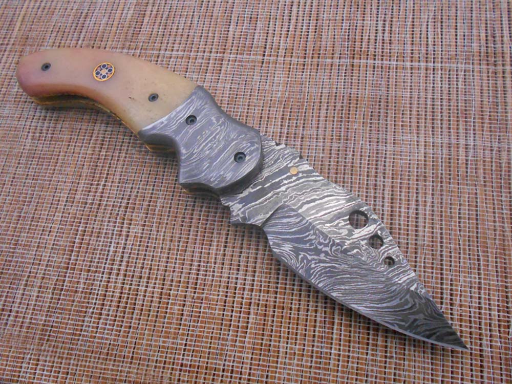 7.5" Folding Knife, 3.5" Hand Forged Twist Pattern Damascus Steel Blade with 3 Holes, Available in 3 Scale colors Pocket Knife, Liner Lock & Thumb knob Equipped, Cow Hide Leather Sheath included