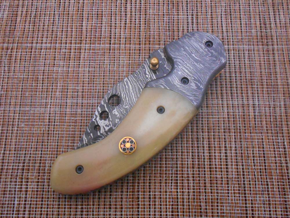 7.5" Folding Knife, 3.5" Hand Forged Twist Pattern Damascus Steel Blade with 3 Holes, Available in 3 Scale colors Pocket Knife, Liner Lock & Thumb knob Equipped, Cow Hide Leather Sheath included