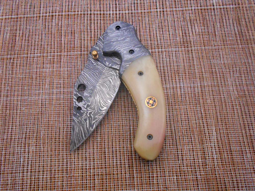 7.5" Folding Knife, 3.5" Hand Forged Twist Pattern Damascus Steel Blade with 3 Holes, Available in 3 Scale colors Pocket Knife, Liner Lock & Thumb knob Equipped, Cow Hide Leather Sheath included
