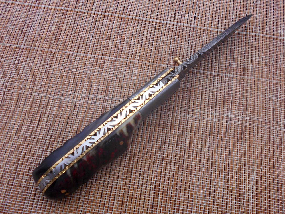 7.75" Damascus steel folding knife, liner lock, thumb knob, Cow sheath
