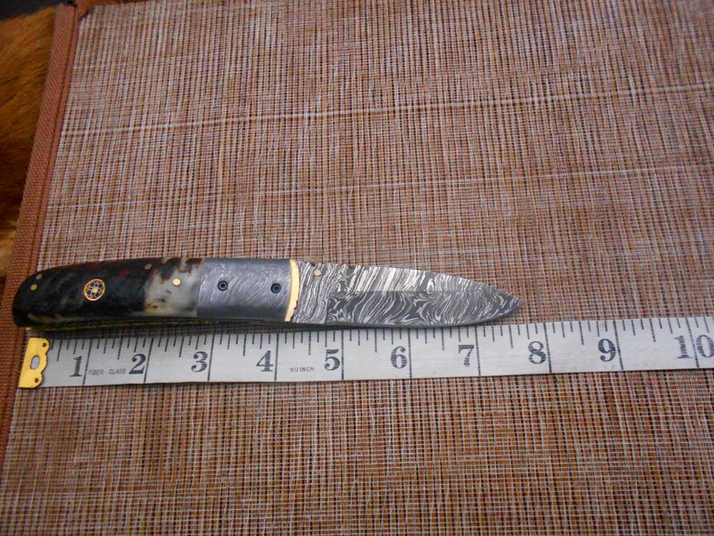 7.75" Damascus steel folding knife, liner lock, thumb knob, Cow sheath