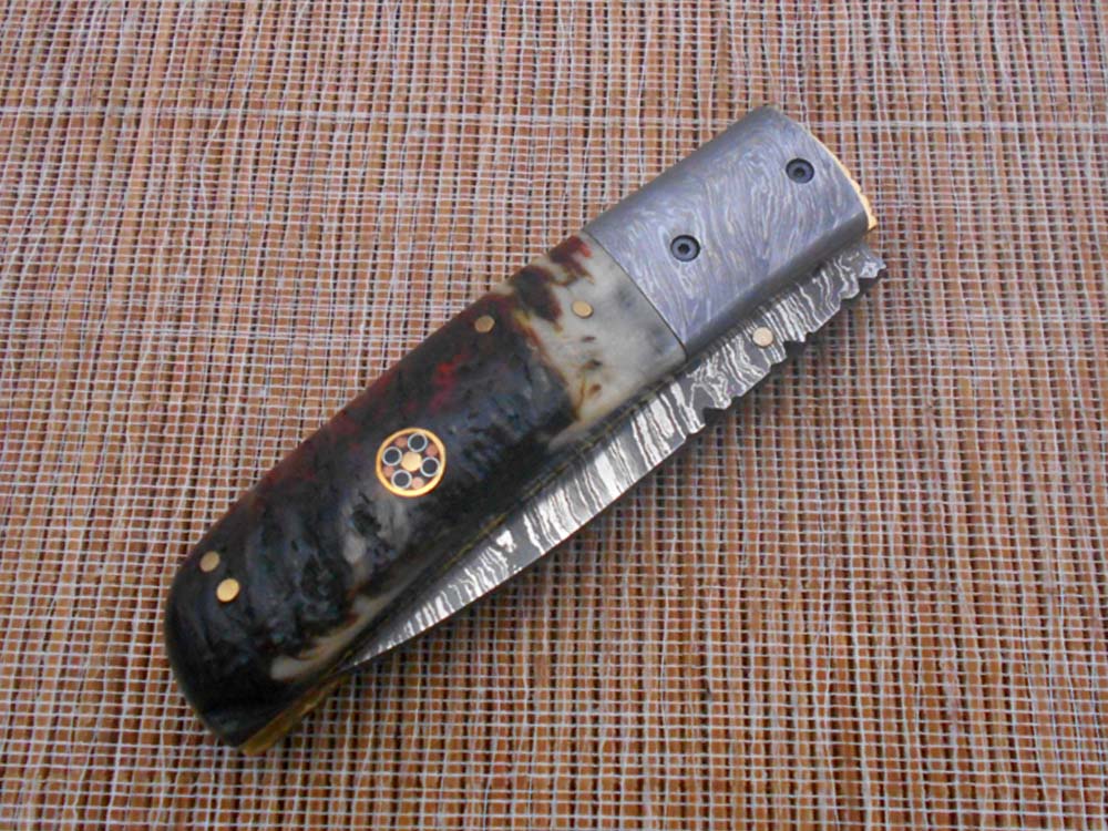 7.75" Damascus steel folding knife, liner lock, thumb knob, Cow sheath