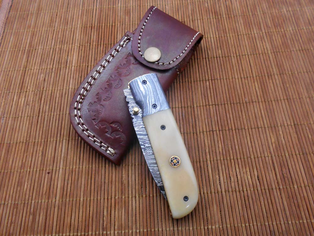 7.75" Damascus steel folding knife, liner lock, thumb knob, Cow sheath