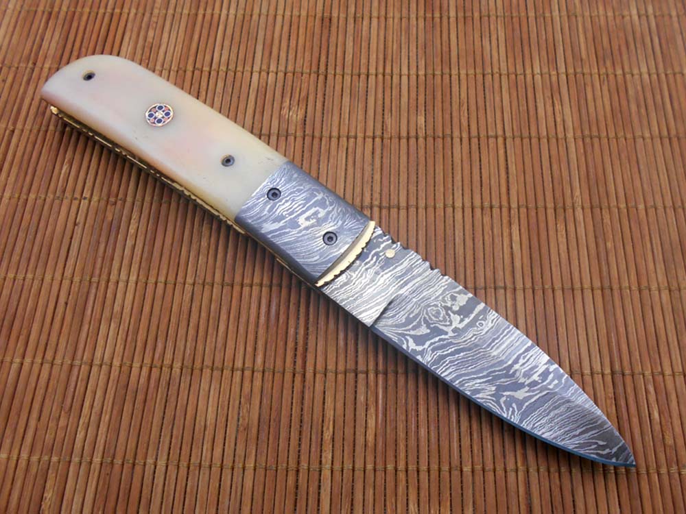 7.75" Damascus steel folding knife, liner lock, thumb knob, Cow sheath