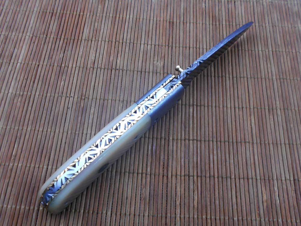 7.75" Damascus steel folding knife, liner lock, thumb knob, Cow sheath
