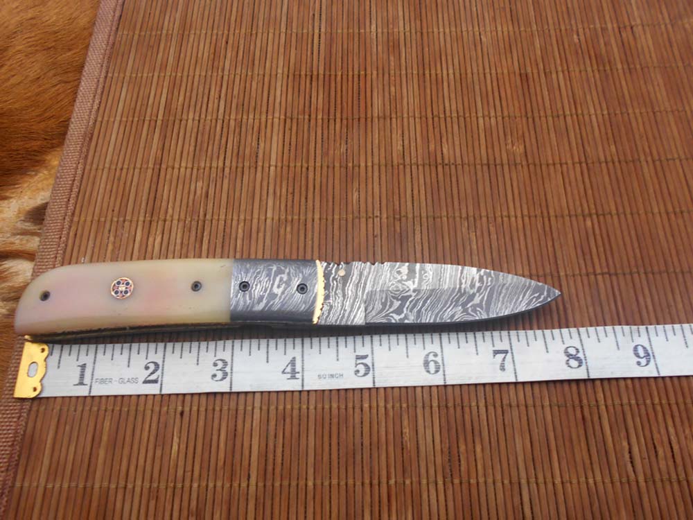 7.75" Damascus steel folding knife, liner lock, thumb knob, Cow sheath