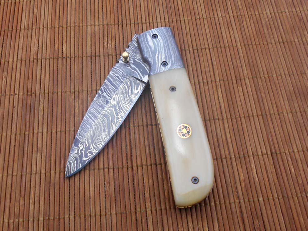 7.75" Damascus steel folding knife, liner lock, thumb knob, Cow sheath