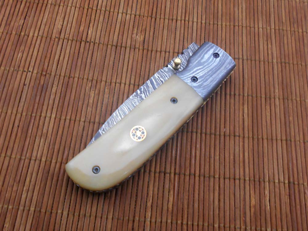 7.75" Damascus steel folding knife, liner lock, thumb knob, Cow sheath