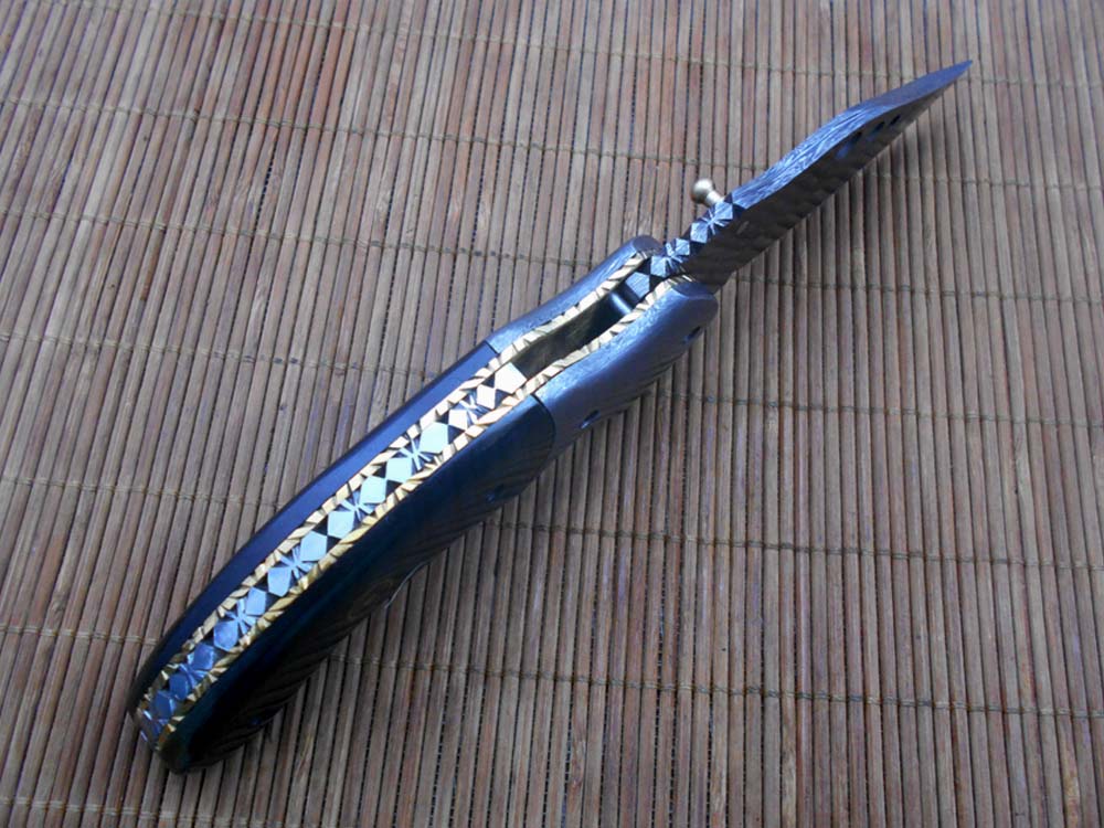 7.5" Folding Knife, 3.5" Hand Forged Twist Pattern Damascus Steel Blade with 3 Holes, Available in 3 Scale colors Pocket Knife, Liner Lock & Thumb knob Equipped, Cow Hide Leather Sheath included