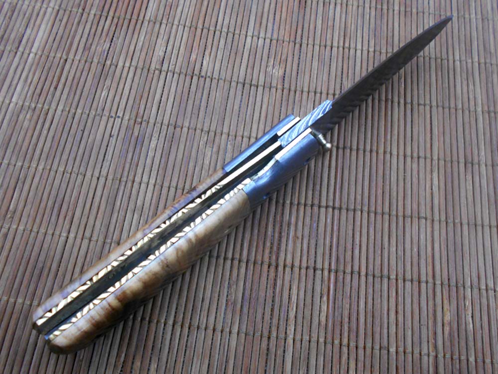 7.75" Damascus steel folding knife, liner lock, thumb knob, Cow sheath
