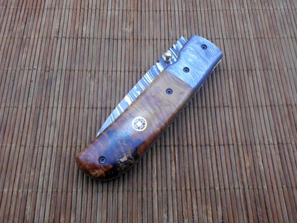 7.75" Damascus steel folding knife, liner lock, thumb knob, Cow sheath