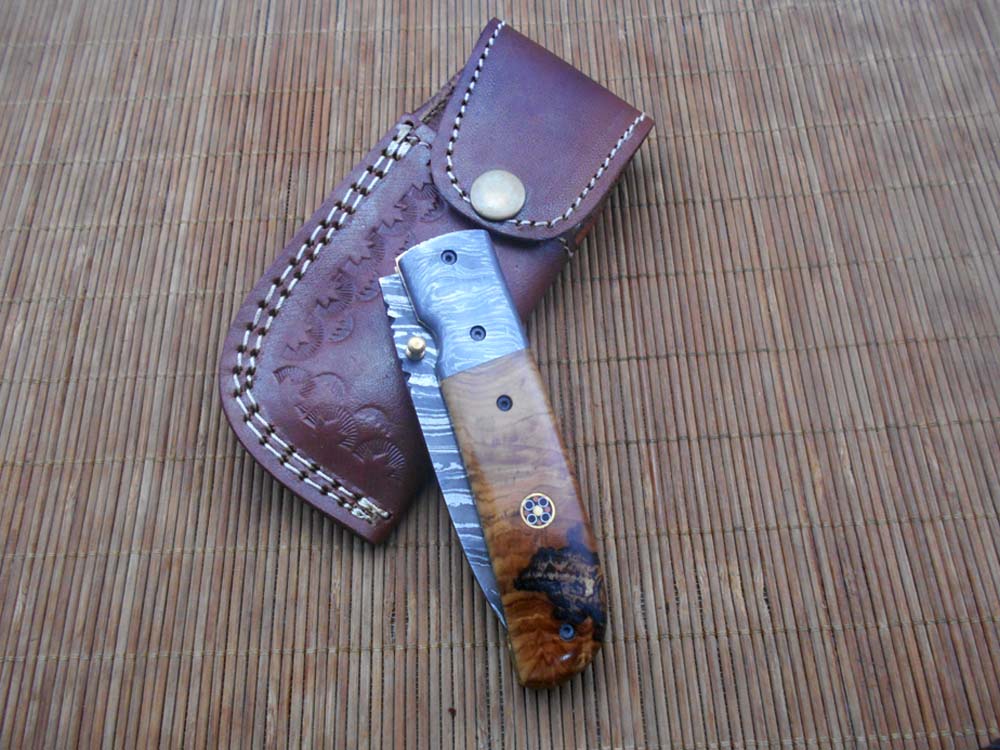 7.75" Damascus steel folding knife, liner lock, thumb knob, Cow sheath
