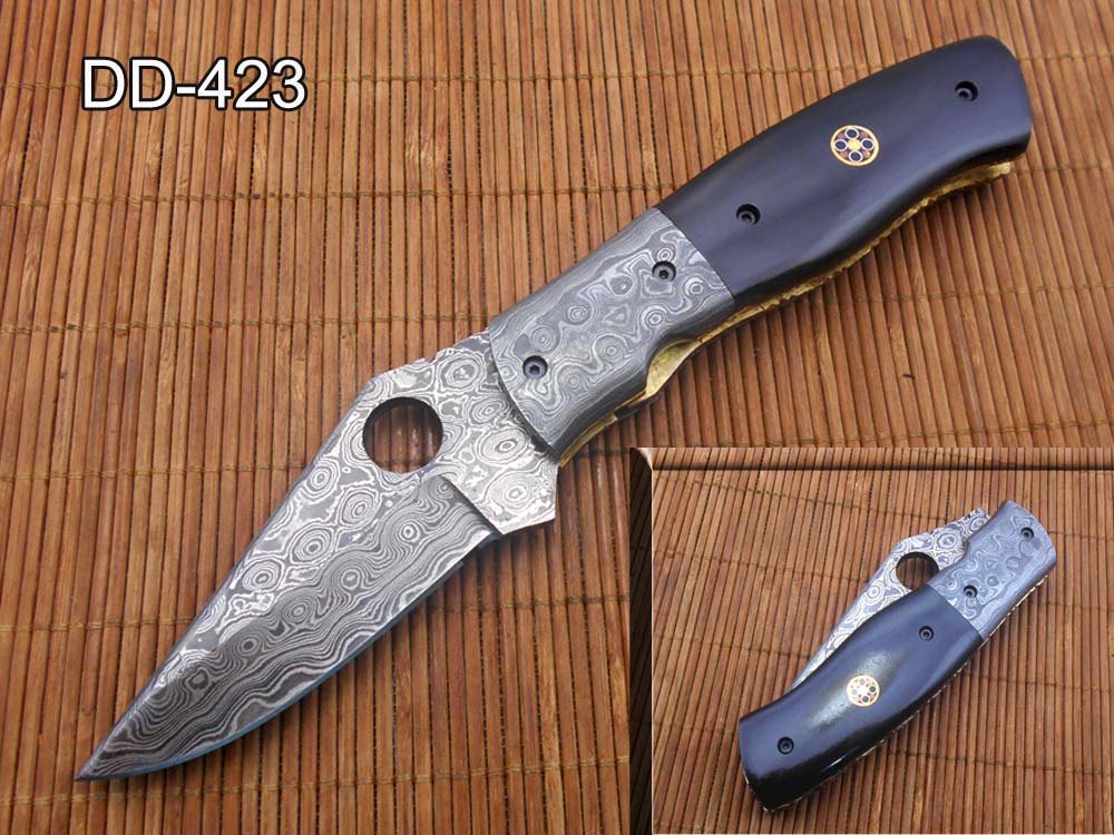 7.5" flat scale folding knife, Damascus steel blade with finger hole, Equipped with liner lock, Available in Wood & Horn scales, Leather sheath included