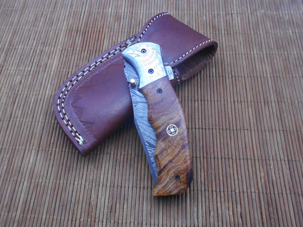 Folding knife Tracker blade knife with Engraved bird on steel bolster, 8" Hand forged Damascus steel, Available in 3 scales, Equipped with Brass Liner lock, Cow hide Leather sheath with belt loop