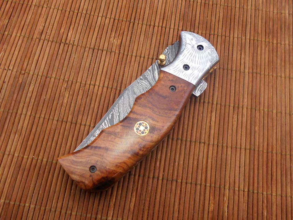 Folding knife Tracker blade knife with Engraved bird on steel bolster, 8" Hand forged Damascus steel, Available in 3 scales, Equipped with Brass Liner lock, Cow hide Leather sheath with belt loop